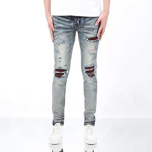 High quality trendy brand spring and summer mens fashionable cat scratch hole slimming jeans Korean elastic small leg pants