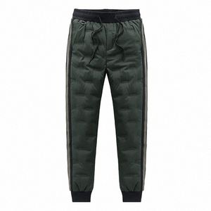 MĘŻCZYZNA GRUGA WYDAJA 2023 MĘŻCZYZNA Zimowe spodnie uchylają się w dół podwładne spodnie Duży rozmiar 5xl jogger wiatproof piórka Polowe spodnie Mężczyźni 07ky#