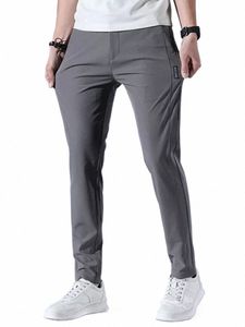 spodnie mężczyzn 2024 Summer Ice Silk Casual Pants Men proste luźne elastyczne cienki styl Szybki suchy młodzież sport