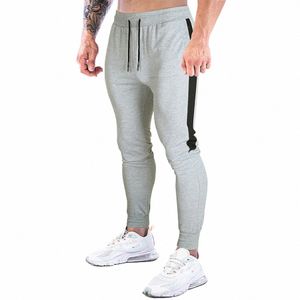 Män Pants Sports Fitn Joggers Sweatpants FI Herrkläder dragsko avslappnade byxor Gym Running Trainers W6lg#