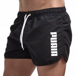 Nowe gorące letnie pnie pływackie Sport Gym Shorss Męskie odzież plażowa luksusowe spodenki plażowe Szybkie suche męskie deski do siwmwearu 70As#