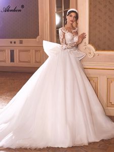 Chic Sliky Tulle Gioiello Maniche lunghe Abito da sposa a trapezio Perline Applicazioni scintillanti Abiti da sposa eleganti in pizzo ricamati con gonna corta rimovibile