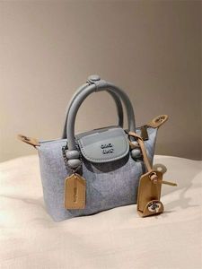 متجر كروسوديس رخيصة التصدير Nanfeng 2024 New Platinum Blue Denim Tote Frasnable and Handheld One Loftle1uan