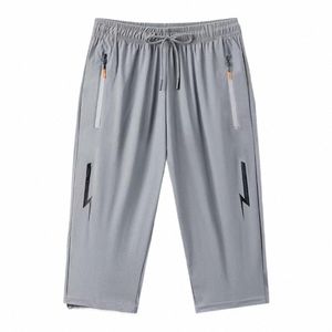 Män beskärda byxor Elastiska midja blixtlåsfickor Män Summer Sweatpants Fit Loose Wide Leg Men byxor manliga kläder E4ft#