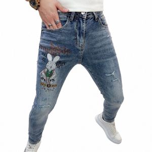 Корейская роскошная одежда Мужские джинсы с дырками Узкие эластичные брюки Wed Lg Весна Лето Брюки с вышивкой кролика и принтом I5mg #