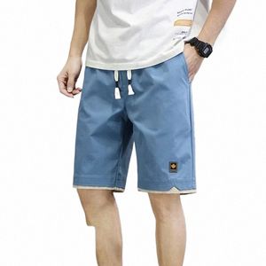 Letnie męskie spodenki sporty pięciopunktowe spodnie luźne swobodne spodnie na plażę mężczyzn solidne kolory