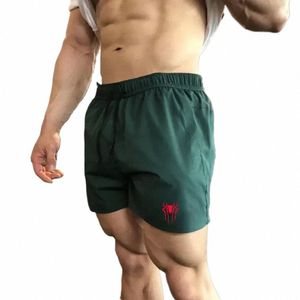 Mäns sport shorts gym lyxdesigner andningsbara svettbyxor jorts koreanska recensioner många löpande dragskor tre fjärdedelar r6if#