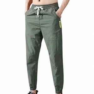 мужские повседневные брюки 2022Новые однотонные брюки-карго с несколькими карманами на шнуровке и завязками на щиколотке Летние самые популярные брюки-карго большого размера i3SU #
