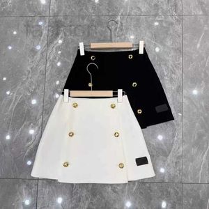 Skirts Designer Early Spring New Half Skirt Metal Button A-line Skirt Mini Skirt Silhouette Short Skirt Slimming Half Skirt Wrapped Hip Skirt XWYQ