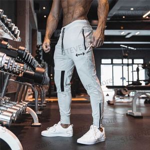 Herrbyxor 2023 Nya män Sweatpants Gym Fitness Sport Pants Bodybuilding Joggers Workout Trousers Men Zip Pocket Bomull Pencil Pants Men T240326