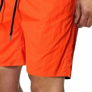 męskie spodenki na plażę Summer stały kolor Fifth Pants Catch Oddychający kieszenie na sznurku zamknięcia szybkie suche spodenki 2021 n1mn#