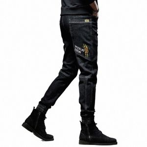Весна Осень Повседневные брюки с несколькими карманами Эластичный дизайнерский джинсовый мужской 2023 Уличная одежда МОДА Сращивание черных джинсов Slim Fit Брюки b4pB #