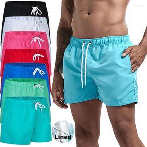 Calções de banho masculinos com forro de malha bolsos laterais sólidos shorts de praia secagem rápida leve cordão verão