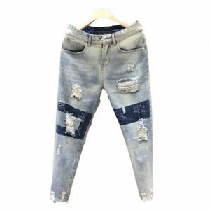 カジュアルなスキニージーンズの快適なスリムが破壊されたジーンズは穴のある小さな足のあるストリートウェアの男性ジーンズの夏の服32to＃