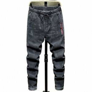 Designer plus storlek 9xl 10xl jeans för män Elastisk midja Löst bekväma casual harembyxor Black Blue Denim Trousers 61J0#