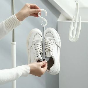 O rack de secagem de calçados duplos pode ser pendurado verticalmente e empilhado, com um rack de secagem de sapatos à prova de vento de 360 ​​°