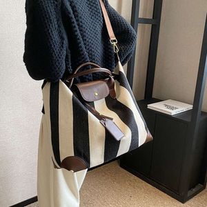 Bolsa de ombro designer vende bolsas femininas de marca quente com 50% de desconto na moda casual nova moda bolsa textura crossbody das mulheres