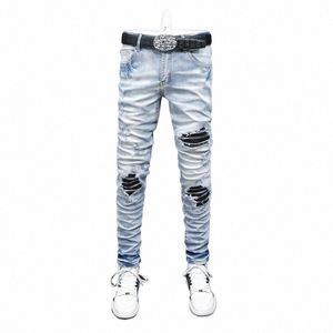 High Street Fi Men Jeans Retro jasnoniebieskie rozciąganie chude dopasowanie dżinsy mężczyzn Mężczyzny skórzane Patched Designer Pants marki Hip Hop F1ko#