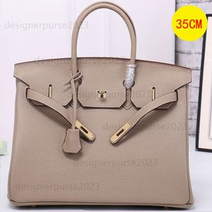 Klassiska avslappnade väskor 2024 Fashion Leather Designer Bag Long Strap Lady Women Tote Handväskor mjuka klassiska kvinnors litchee mönster Birkkins huvudhandväska doja