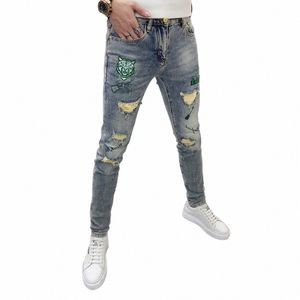 Nowy projekt designerski męski dżinsy kpop w stylu haft tygrysa rozryte koreańskie luksusowe streetwear szczupły kowbojskie dżinsowe spodnie m9ej#