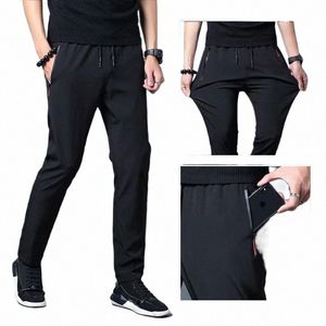 Mäns avslappnade byxor Busin Stretch Slim Fit Elastic midjejoggare Korean Classic Blue Black Grey Mane Märkesbyxor F5QY#