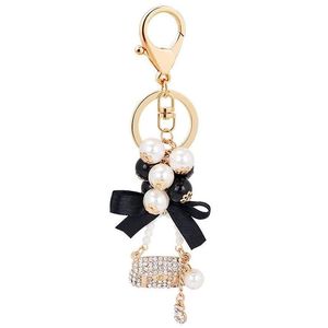 Keychains Lanyards Pearl Alloy Metal Handbag Key Chain Fashion Ring Pom Gifts For Women Girls Bag Charm Keychain Pendant Jewelry Drop Dhzwb
