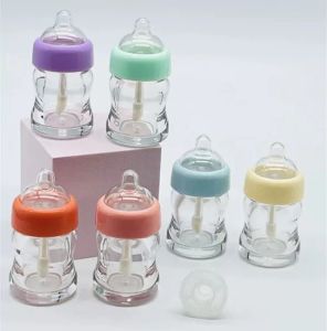ボトル10100pcs 6ml空のミルクボトルリップグロスチューブDIYプラスチックリップグロスチューブ透明/黄色/ピンクリップグロス化粧品コンテナ