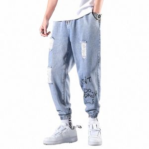 Vårens hösten 2022 Nya rippade jeans Men Mäns koreanska lösa varumärke Ljusfärgade tonåringar Cowboy Leggings Harem Pants Men U894#