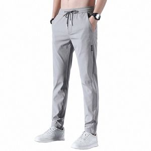 Pantaloni da uomo in seta di ghiaccio 2023 Estate Nuovo Nero Grigio Sottile Busin Pantaloni casual Outdoor Elastico traspirante Pantaloni sportivi a gamba dritta A7xT #