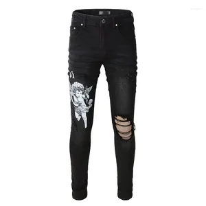 Mäns jeans svarta streetwear ihåliga ut skadade hål denim byxor tryck bokstäver ängel mönster tryckt mager sträcka stretch