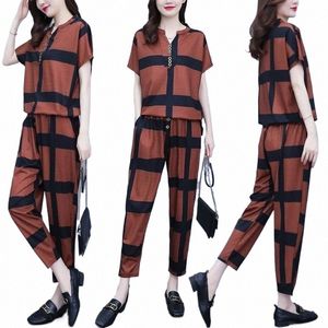 Kvinnors avslappnade kostym 2023 Spring Summer New Fi Loose Korean Plus Size Clothing Short Sleeve Tops Harun Pants 2 Two Piece Set 50fn#