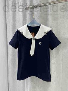 Polo da donna Felpe firmate T-shirt stile blu scuro Primavera/Estate Nuova cravatta con perline Decorazione Raso Acido acetico Bordo ondulato PoNeck Manica corta NDNK