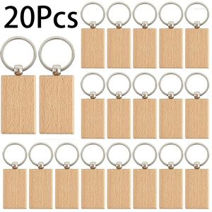 Keychains 20st oavslutade trä Keychain Rectangle Nyckeltaggar Ringar för DIY -hantverkstillbehör