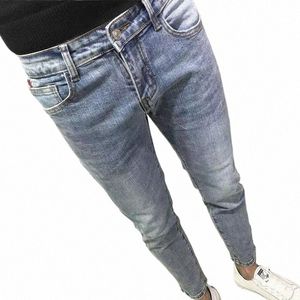 Nowy polerowany tkanina dżinsowa Wed Koreańskie fi rozryte kowbojowe dżinsy spodnie chude tkaniny stylowe niebieskie spodle z przycięciem vintage 300G#
