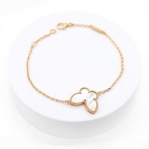 Designer Original Brand Van Four Leaf Grass Butterfly Armband Double Sided Natural White Fritillaria Room Thick Plated V Gold 18K Lock Bone Chain Kvinnor med logotyp