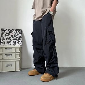Letnie cienkie spodni ładunkowe Mężczyźni moda kieszonkowa kieszonkowa swobodna japońska streetwear Hiphop luźne proste małże spodnie 240328