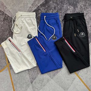 Summer thin ice silk breathable air conditioning pants for mens slim fitting 100 zipper sports leggings milk silk quick drying pants