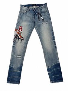 lyxmärke män jeans streetwear am tiger alfabet broderi denim byxa 2024 ny design trendig manlig smal sträcka rippade jean d5x5#