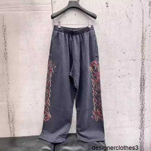 Designer B Family High Edition Paris New Flame Graffiti Pantaloni sanitari stampati Pantaloni sanitari casual mondiali Pantaloni sanitari casual stile uomo e donna M238