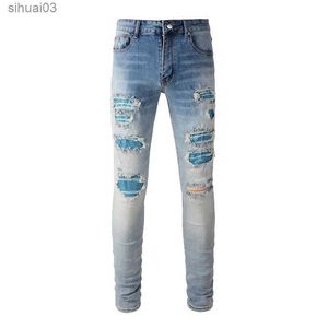 Mäns jeans High Street Perforated Light Blue Crystal Patch High Elastic Ultra Thin Patch Rhinestone Patch Ejressed Ripped Jeansl2403