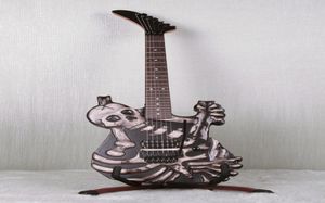 Ręcznie rzeźbiony J Frog George Lynch Skull and Bones Electric Gitara Pełna Pływająca oryginalna Floyd Rose Tremolo Ebony Tfulardboard Korea2910914