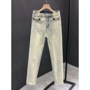 Primavera e outono amarelo lama tingido jeans elásticos, americano solto high street, desgastado pés pequenos, calças cortadas casuais