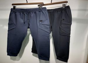 Erkek tasarımcı pantolon sonbahar kış yeni moda jogger kargo pantolon yüksek kaliteli pamuk cepler ekleme tasarım lüks gündelik elastik w7028042