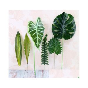 Ghirlande di fiori decorativi Pianta artificiale Grande finta palma Monstera Foglie Foglia di plastica verde per la decorazione della tavola fai da te di nozze Dhpxv