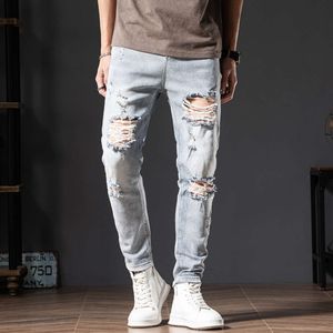 Jeans Beggar's Big Hole di colore chiaro da uomo autunno coreano moda slim fit scooter pantaloni divisi azzurri