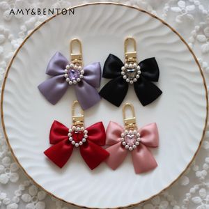 Keychains 일본 미니 진주 보석 활 달콤한 사랑의 하트 라인 스톤 패션 올 매치 휴대 전화 펜던트 자동차 키 체인