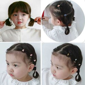 ヘアアクセサリー50/100 PCS/BOX新しい子供かわいい色かわいい色柔らかい弾力性のあるヘアバンドベビーガールズ素敵なスクランチラバーバンドキッズヘアアクセサリー