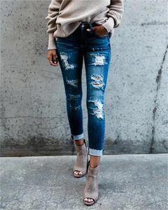 Kvinnors jeans avslappnad mager blyertsbyxa kvinnor streetwear hål slitna smala byxor trendiga rippade stretch ljus blå denim byxor för kvinnlig