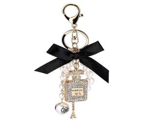 2022 Imitation Pearl Perfume Bottle Keychain Car Key Ring Holder Bag Charm Pendant Accessories Bow Key Chain Fashion Keyring AA2206869221