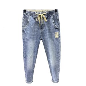 Vår sommarkoreanska mode män lyxiga jeans overaller elastiska dragkonstlast tvättade kläder avsmalnande baggy joggers byxor 240426